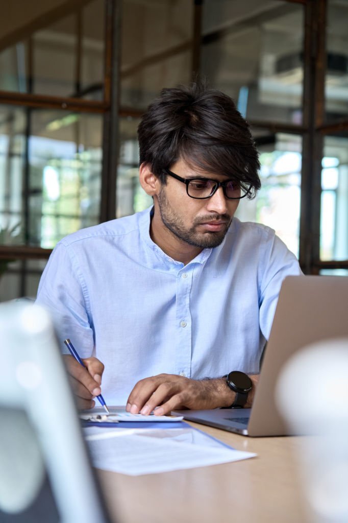 A Man Working On His Laptop